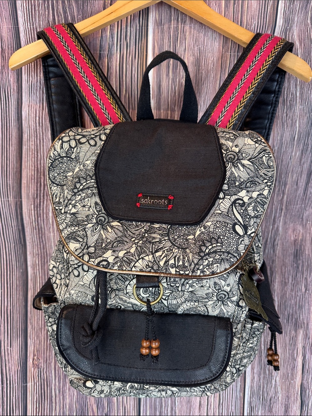 Sakroots Black and Cream Floral Canvas Backpack with Pink Accent Straps